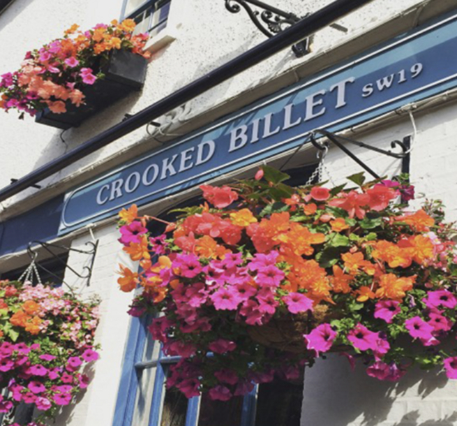 Crooked Billet pub sign with hanging baskets