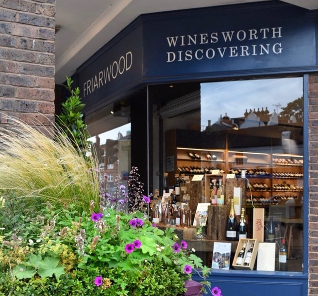 Friarwood Wines exterior with planter in front