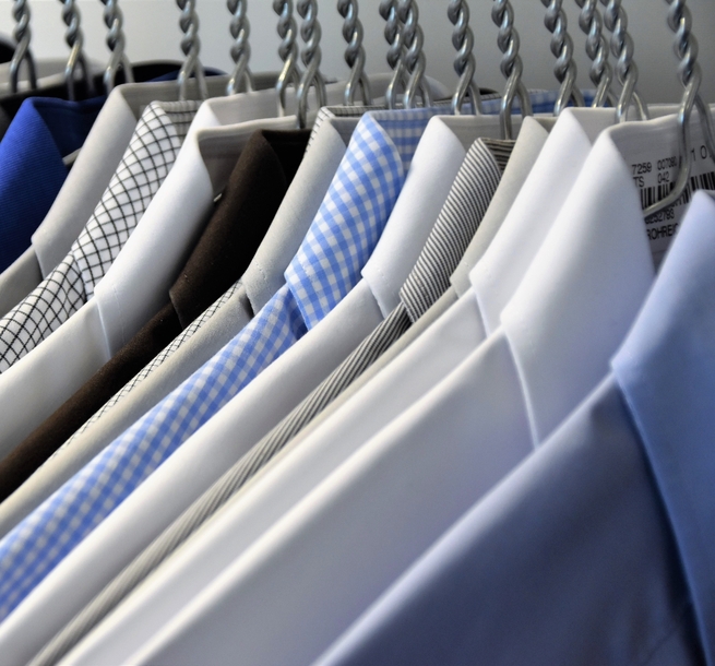 American Dry Cleaning - shirts on rail stock image