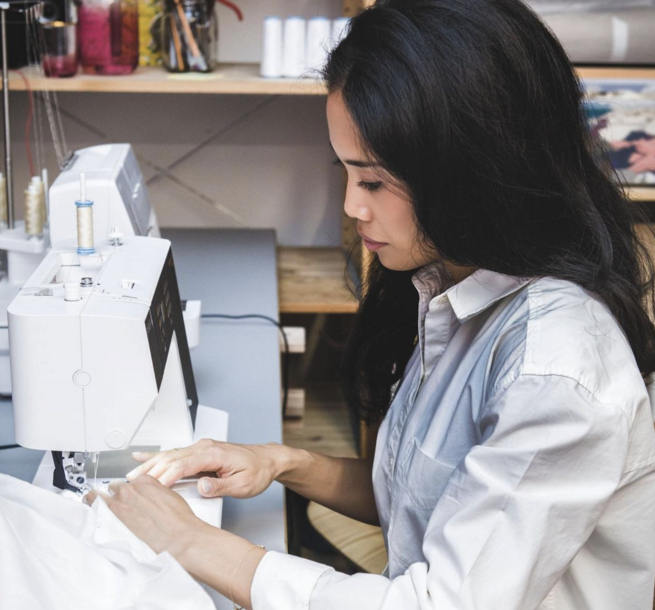 Ashley Groom Studio - Ashley working at sewing machine