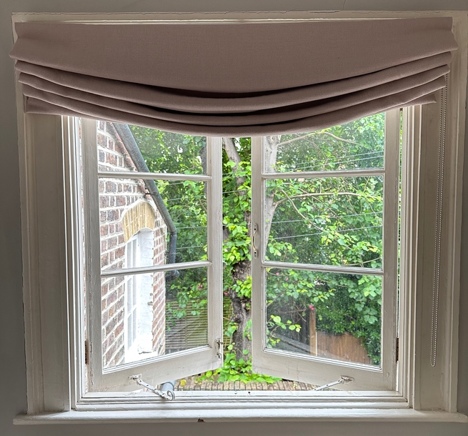 Ashley Groom Studio roman blind over open window