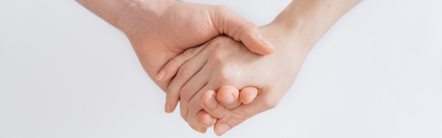 Medical care image - holding hands