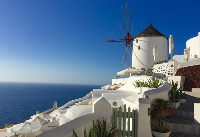 Greek building on a hilltop overlooking the sea